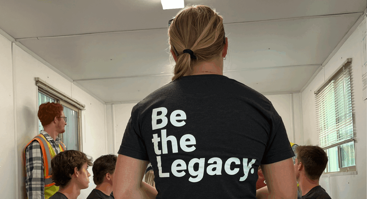 Interns at a sight visit with Lamp Rynearson's Be the Legacy tshirts on
